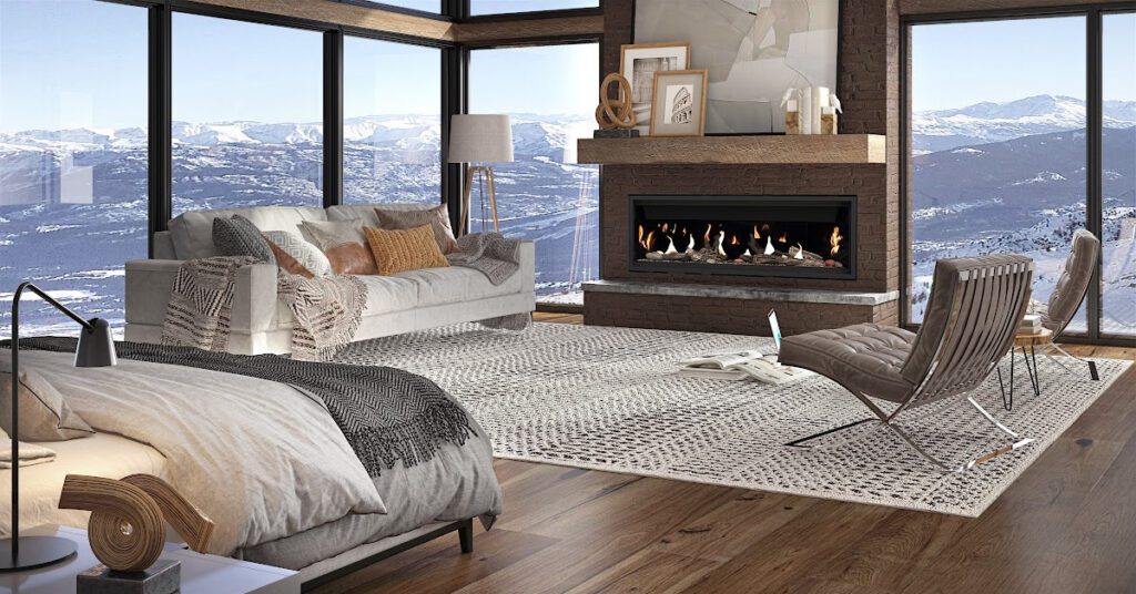 Une magnifique chambre a coucher avec vue sur les montagnes contenant un foyer au gaz
