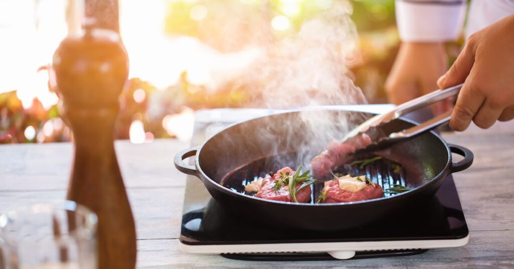 A steak is grilled in a cast iron